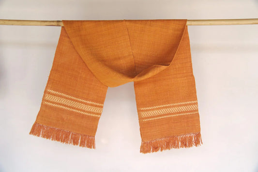 Eri silk stole in orange with a golden design